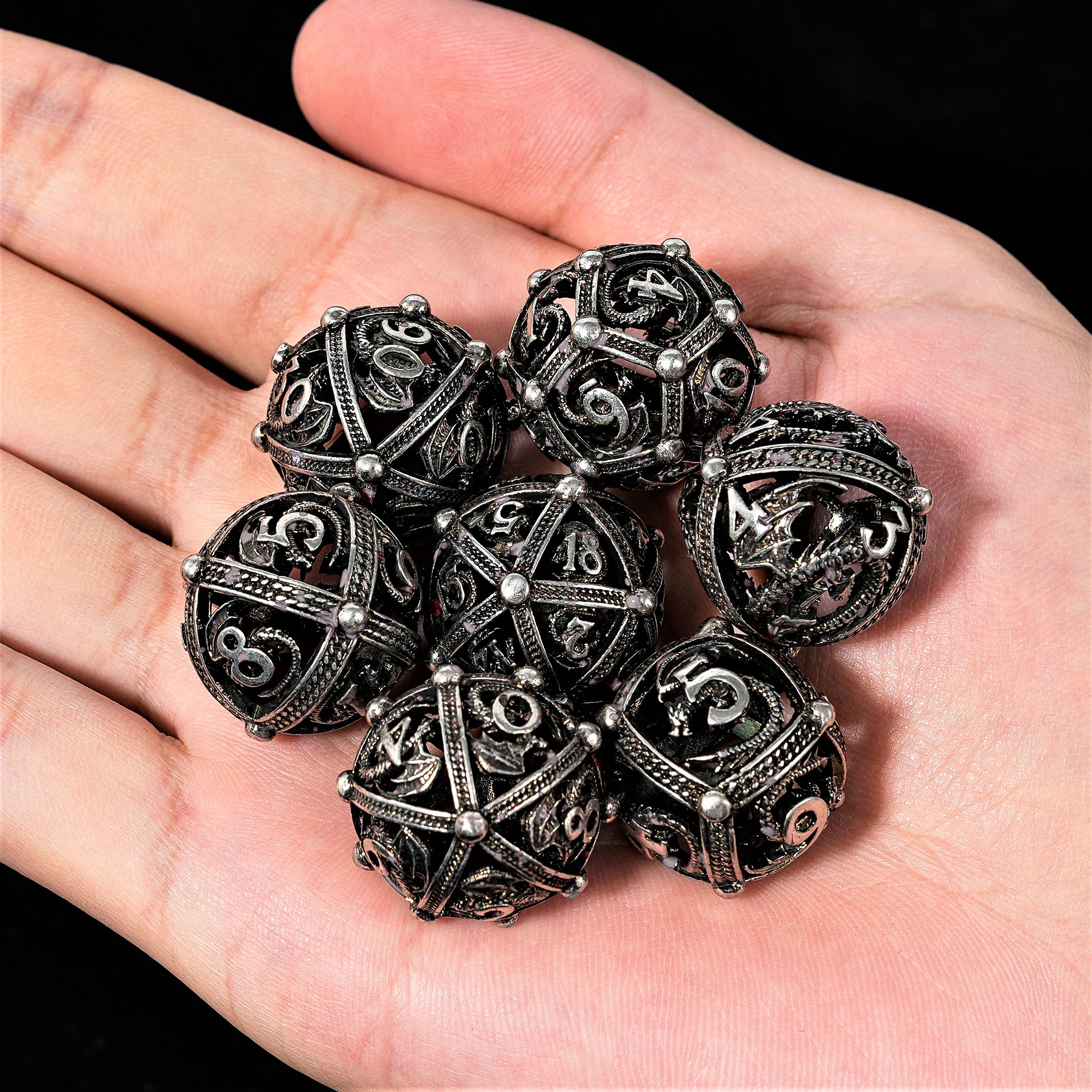 Unique 7-Piece Round Hollow Orb Metal Dice Set - Dragon Design