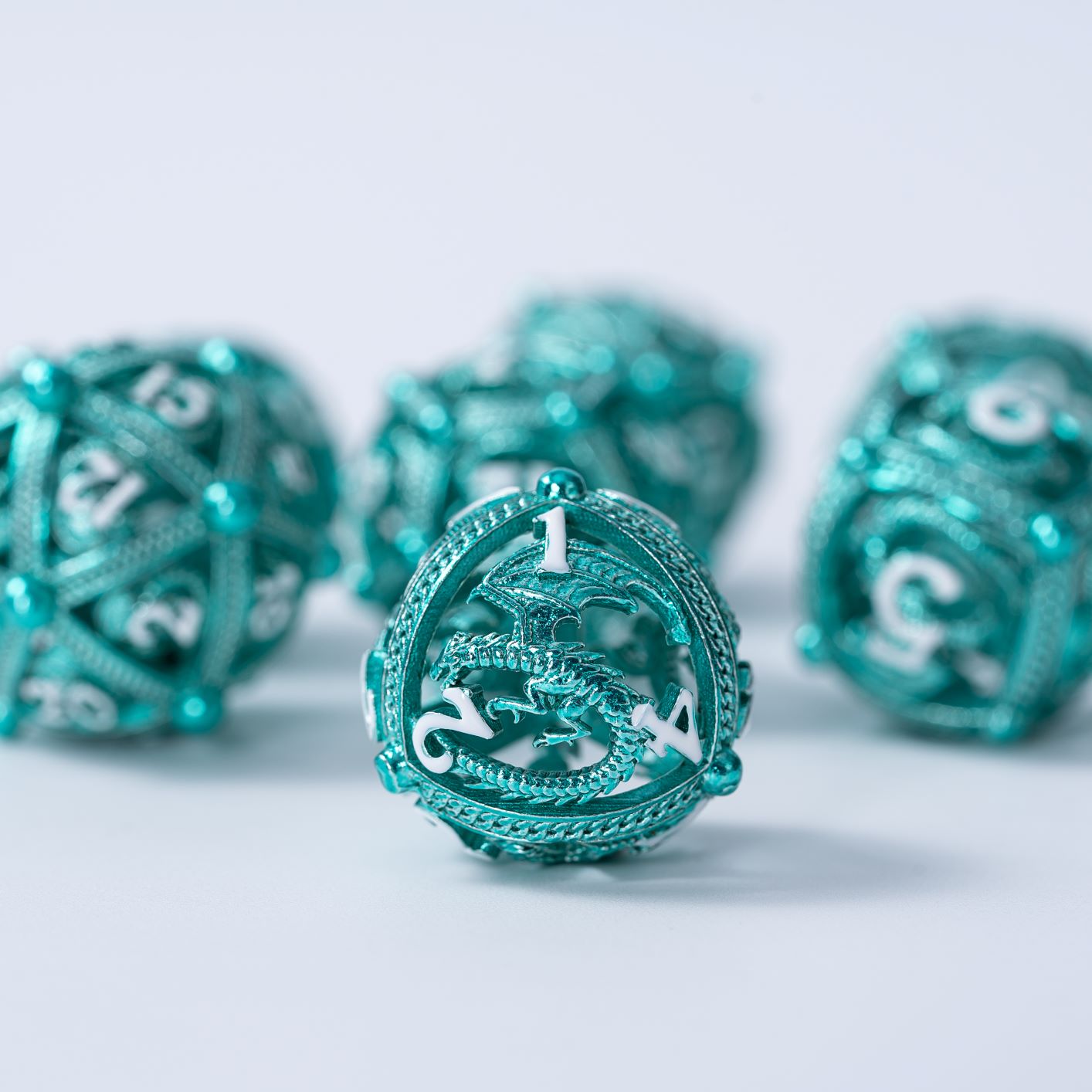 Unique 7-Piece Round Hollow Orb Metal Dice Set - Dragon Design