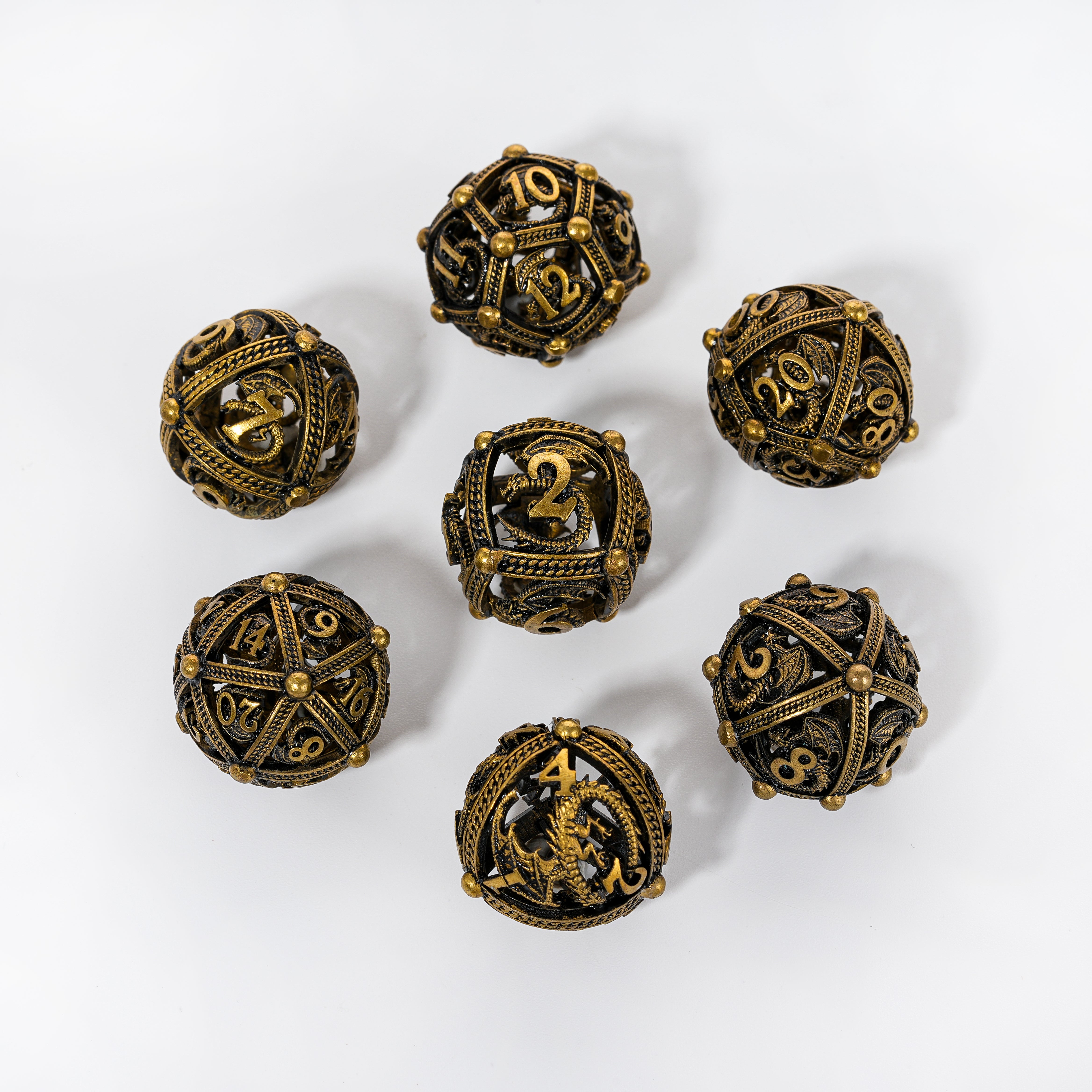 Unique 7-Piece Round Hollow Orb Metal Dice Set - Dragon Design