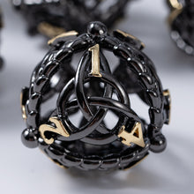 Load image into Gallery viewer, Unique 7-Piece Round Hollow Orb Metal Dice Set - Celtic Knot Design Black Gold