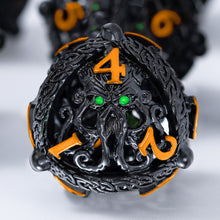 Load image into Gallery viewer, Unique 7-Piece Round Hollow Orb Metal Dice Set - Cthulhu Design Black Orange